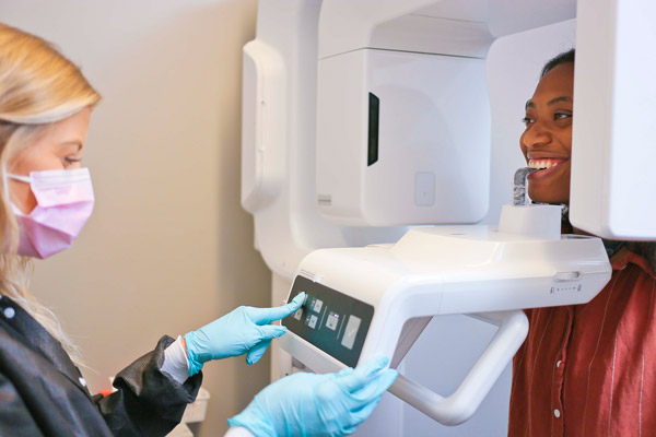 Dental Assistant scanning using 3D scanner on a patient at Singing River Dentistry in Russellville, AL.