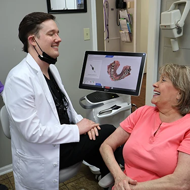 Dr. Connell and a patient at Singing River Dentistry in Russellville.