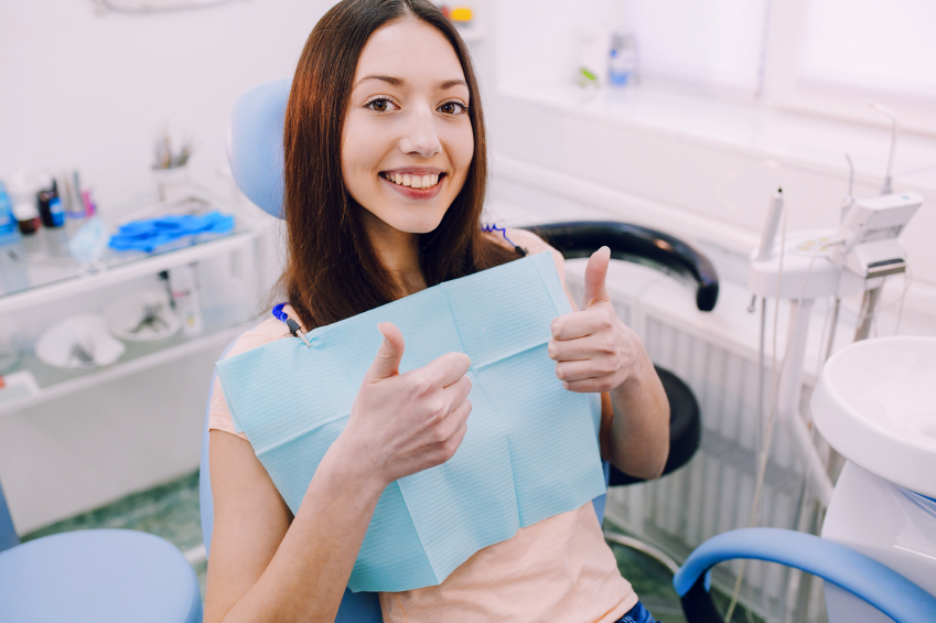 Image of a young woman after her oral hygiene treatment at Singing River Dentistry.